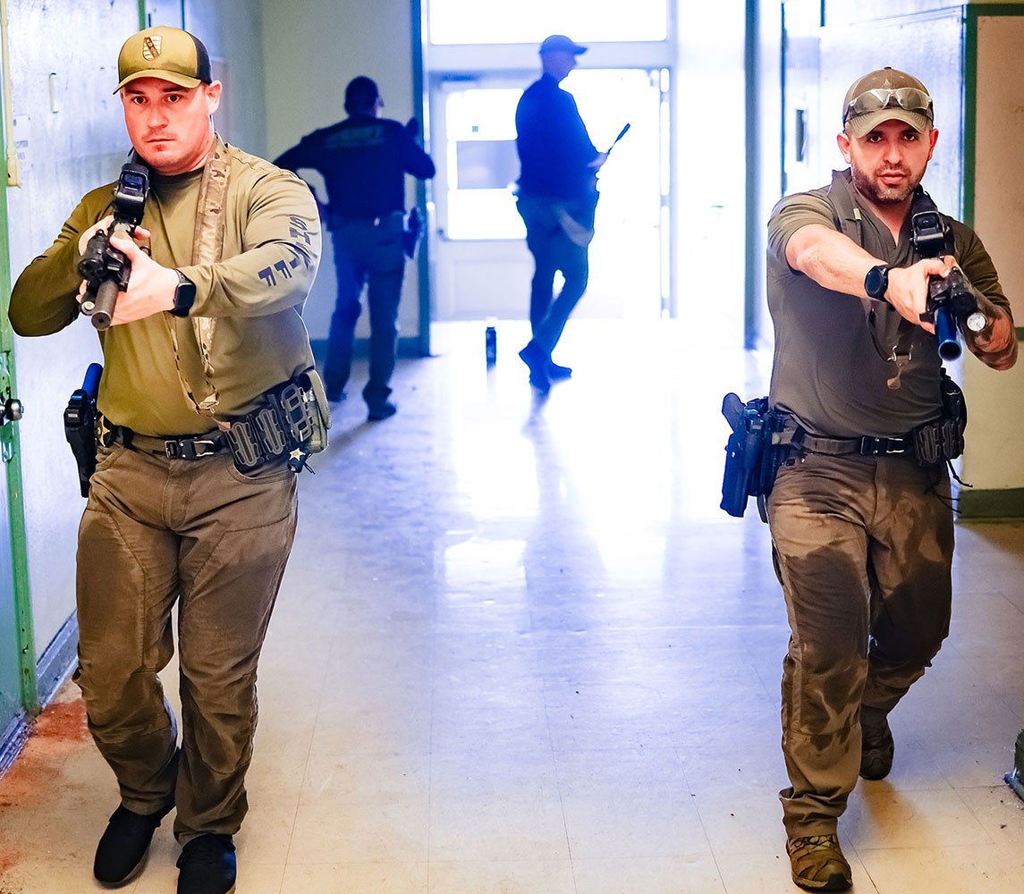 two officers walking down hallway in active threat instructor training course