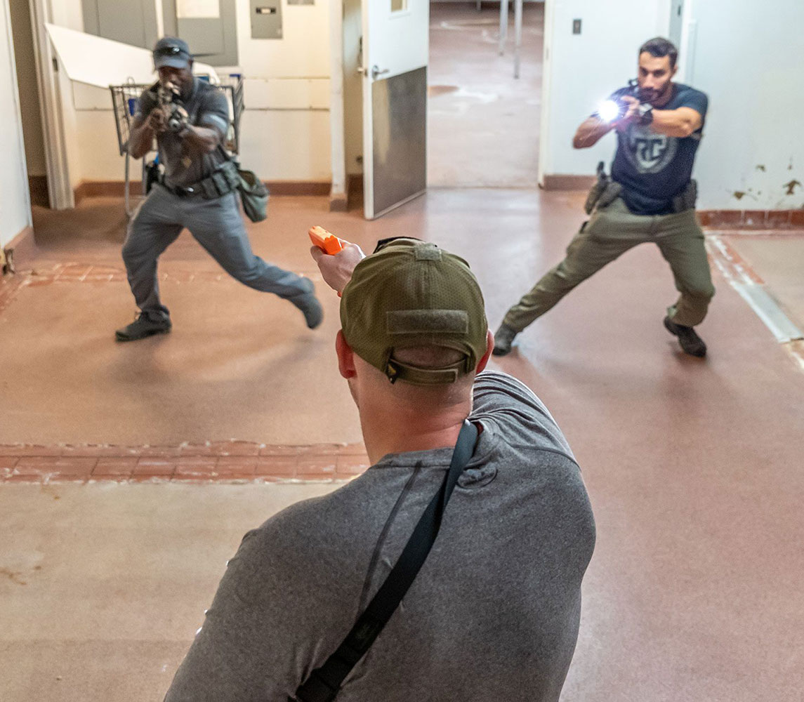 three males participating in cqc high threat training course