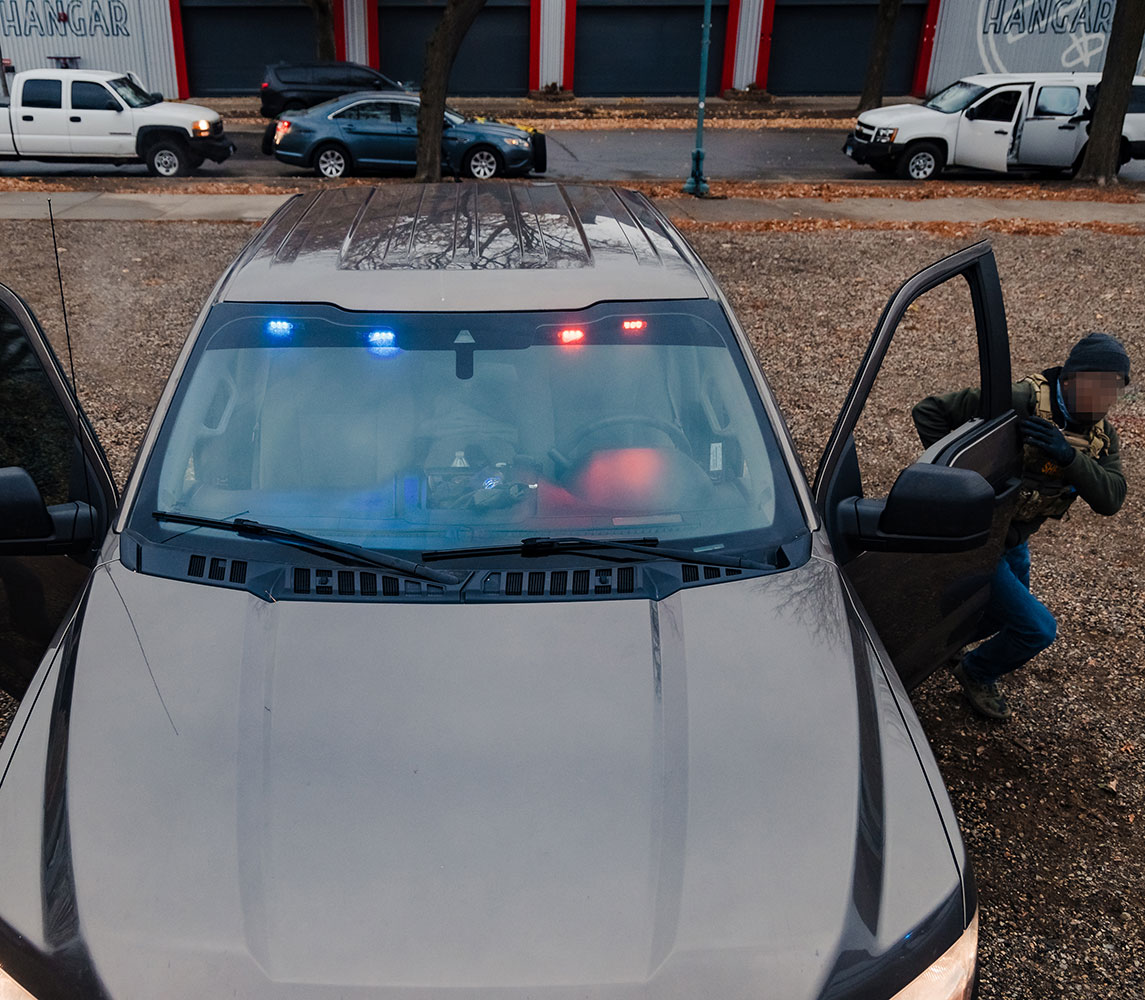 officer exiting vehicle quickly during Undercover Rescue Vehicle Tactics Course