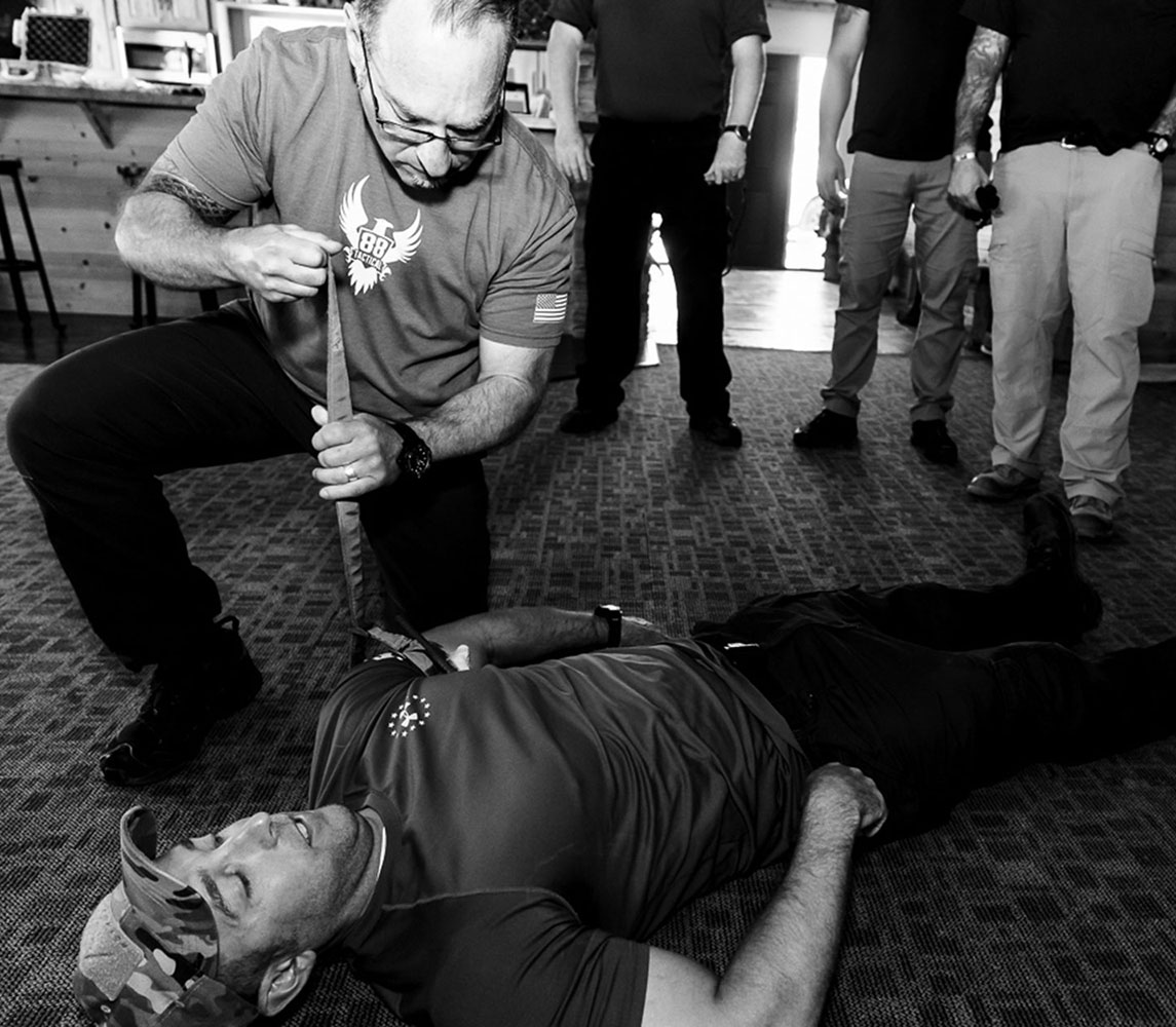 students watching instructor demonstrate tacmed procedure in specialized tacmed instructor training course